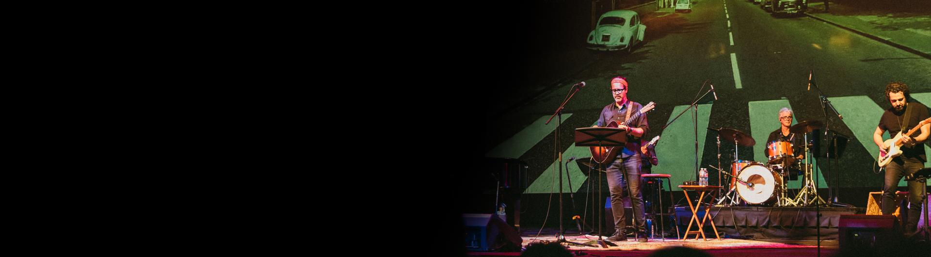 Members of Live from Laurel Canyon performing on stage