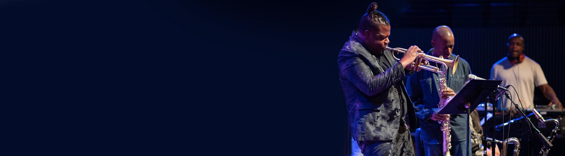 Members of Miles Electric Band, including Keyon Harrold playing the trumpet on stage