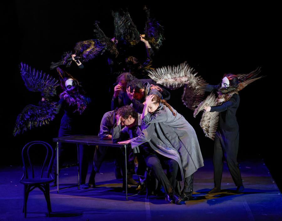Noche Flamenca performers with winged dancers in a dramatic stage scene